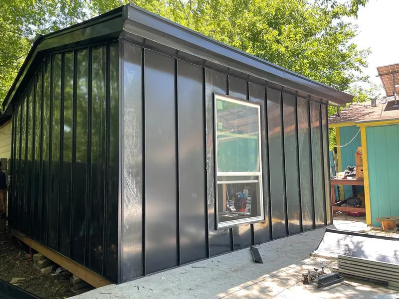 Black standing seam metal wall panels for Roof Inspection in O'Hara